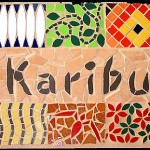 caribou welcome sign in Swahili language, bright colourful ceramic mosaic