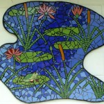 mosaic mural with frog, Lillies and reeds in a blue pond