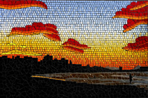 mosaic mural depicting brightly sunset in cane fire season