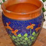 mosaic pot with canna Lillies design orange and yellow flowers