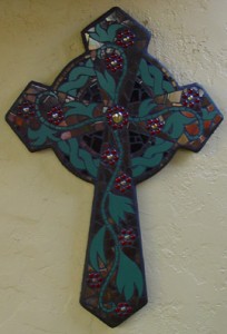 Celtic cross in green and red ceramic mosaic