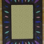 bright leaf shapes on a black background on mosaic mirror