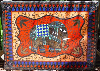 mosaic of Ganesha in reds blues and gold