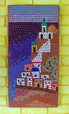 Mosaic mural representing a greek island scene against ocean backdrop