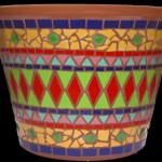 geometric mosaic design on a terracotta pot