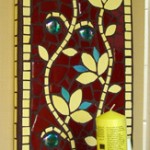 Indian flowers mosaic design in burgundy and yellow as a candleholder