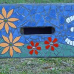 mosaic letterbox with colourful flowers