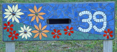 mosaic letterbox with colourful flowers