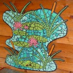 mosaic mural with frog, Lillies and reeds in a blue green pond