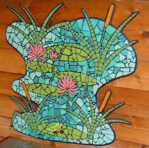 mosaic mural with frog, Lillies and reeds in a blue green pond