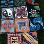 numerous mosaic stepping stones in bright colours
