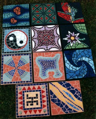 numerous mosaic stepping stones in bright colours