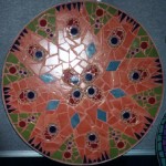Mosaic tabletop inspired by peacock feathers