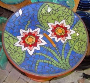 Mosaic birdbath in ceramic with Lillies, lillypads and reeds