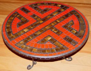 roundshou design in ceramic mosaic in red
