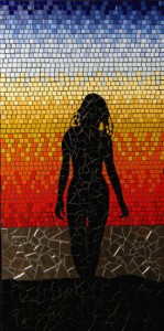 silhouette of woman against sunset in colourful ceramic mosaic