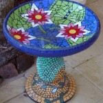 waterlilies and lily pads on a ceramic mosaic birdbath