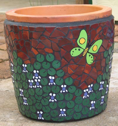 violets and butterfly on a pot in ceramic mosaic