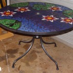large mosaic table with waterlilies and lily pads and dragonfly