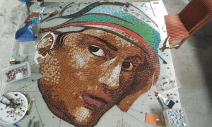 Full face and colourful headband completed on the commemorative mosaic artwork